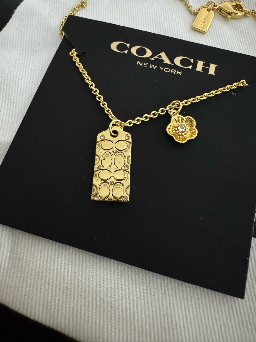 Coach Gold-Tone Logo Tag and Flower Charm Necklace
